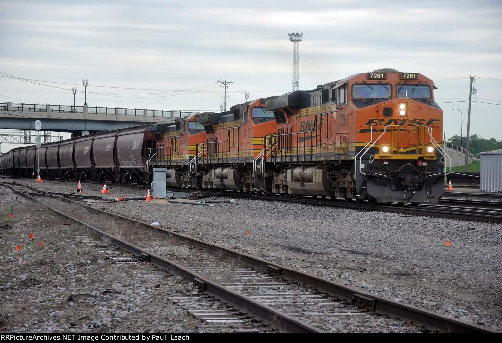 Grain train rolls east through University